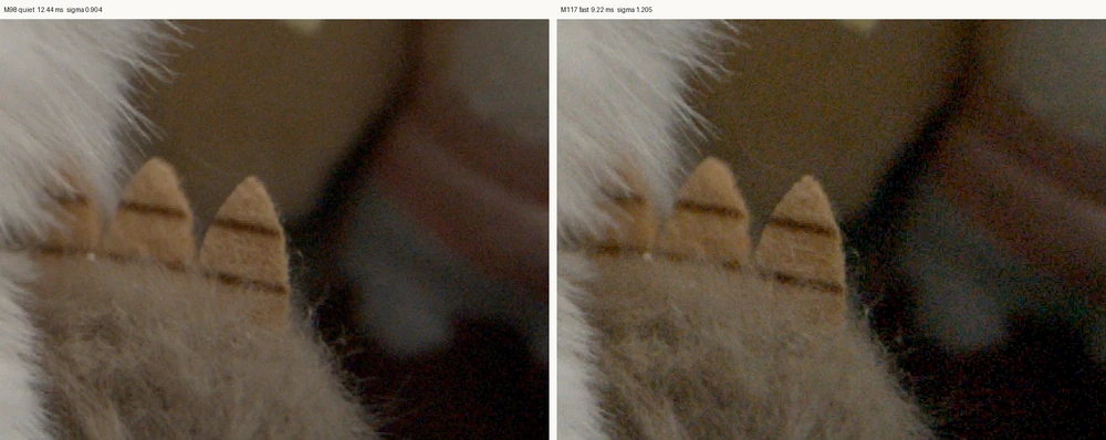 Side by side crops of a shadowed background at ISO 100 lifted thirty-four times, M98 on the left and M117 on the right. The M117 frame carries visibly more coloured speckle.